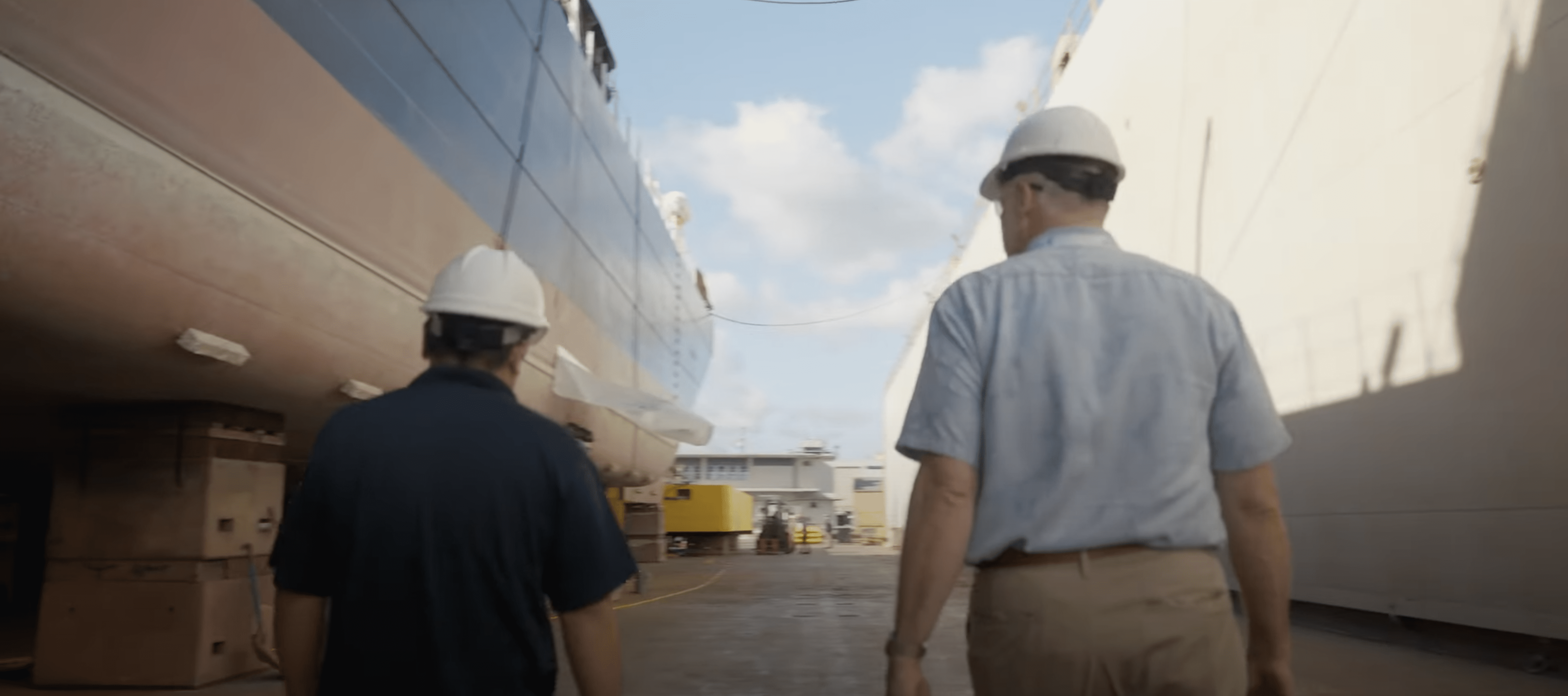 two man walking with hard hats on - Applied CAx Siemens software partner USA